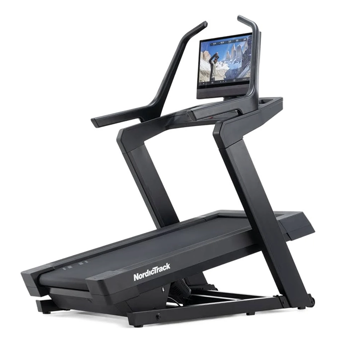 A person running on the NordicTrack X24 Treadmill, showing its large 24-inch touchscreen display