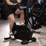 A close-up of the Comfort Curve seat on the Bike Club Series Plus Upright Lifecycle SL, highlighting its ergonomic shape and adjustments