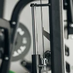 A close-up of the two adjustable safety catches on the Upper Body Smith Machine, emphasizing their role as a spotter