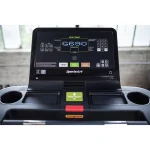 A person demonstrating the sled-push mode on the Treadmill G690 Verde SportsArt, emphasizing its versatile functionality