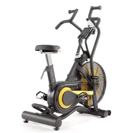 A person performing a full-body workout on the Air Bike Unlimited Mag Cascade, utilizing both arm and leg movements