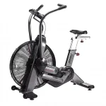 A person performing an intense full-body workout on the Bike Assault AirBike Elite, highlighting its robust construction