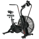 A person performing an intense full-body workout on the Bike AssaultBike Pro X, highlighting its robust design and integrated console