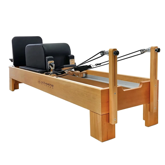 Activemine Pilates Reformer Machine with solid hornbeam wood frame and black upholstery Activemine Pilates Reformer Machine with solid hornbeam wood frame and black upholstery