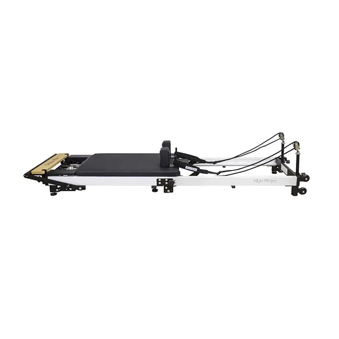 Align Pilates F3 Folding Reformer Machine unfolded in a home gym setting Align Pilates F3 Folding Reformer Machine unfolded in a home gym setting