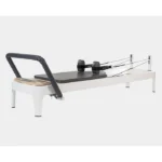 Allegro 2 Pilates Reformer with white aluminum frame and Infinity Footbar
