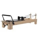 Balanced Body Studio Reformer with solid maple frame and black upholstery