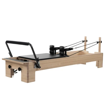 Balanced Body Studio Reformer with solid maple frame and black upholstery