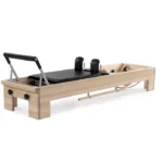 CenterLine Pilates Reformer with traditional maple frame and leather straps