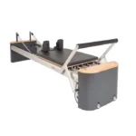 Fitkon Pilates Pro Reformer with premium wood frame and black upholstered carriage