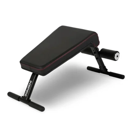 Front view of the Inspire Fitness Mini Crunch Bench set on a clean floor
