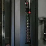 Functional Trainer Titan Fitness Close-up of the quick-adjust pull-pin mechanism on the trainer's pulley, highlighting the numbered vertical positions