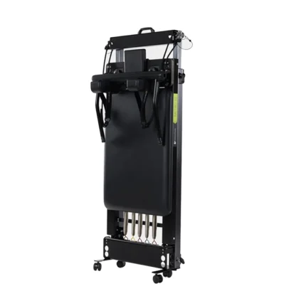 Metro IQ Reformer with Wheelbarrow Wheels extended for a home Pilates workout session