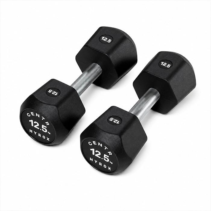 Pair of Centr x HYROX 12.5kg commercial urethane dumbbells on a gym floor Centr x HYROX Commercial Dumbbell Pair of Centr x HYROX 12.5kg commercial urethane dumbbells on a gym floor Centr x HYROX Commercial Dumbbell