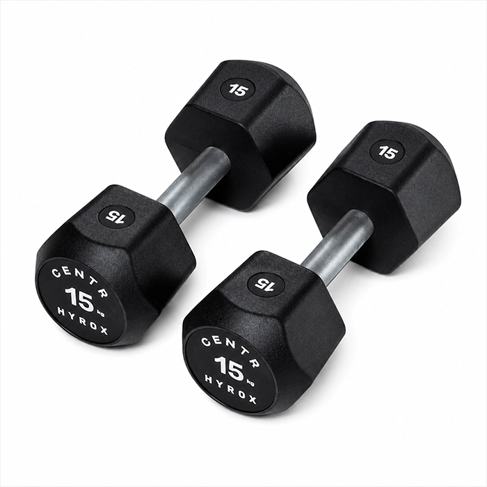 Pair of Centr x HYROX 15kg commercial urethane dumbbells on a gym floor Centr x HYROX 15kg Commercial Dumbbell Pair Pair of Centr x HYROX 15kg commercial urethane dumbbells on a gym floor Centr x HYROX 15kg Commercial Dumbbell Pair