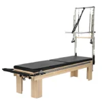 Professional Clinical Reformer with Tower and Mat in a physical therapy clinic