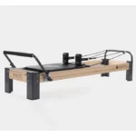 Rialto Pilates Reformer with maple wood frame and black over molded padding