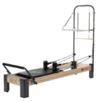 Rialto Reformer with Tower and Mat Pilates featuring a wood and metal design