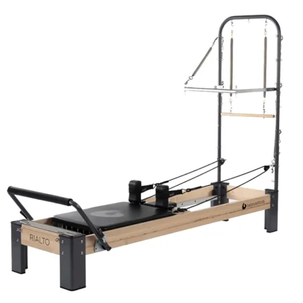 Rialto Reformer with Tower and Mat Pilates featuring a wood and metal design