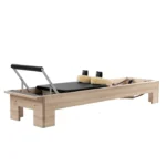 Ron Fletcher Pilates Reformer with solid wood frame and traditional leather straps