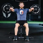 Shoulder Press And Plate Loaded Deltoid A close-up of the machine's adjustable seat, emphasizing the updated design for users under 6 feet tall