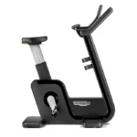 Technogym Artis Bike Black upright stationary bike in a luxury gym setting