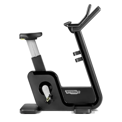 Technogym Artis Bike Black upright stationary bike in a luxury gym setting