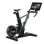 Technogym Ride Smart Bike with immersive 22-inch touchscreen displaying a virtual route