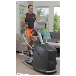 The Elliptical Q37xi Home Octane shown in a home setting, emphasizing its compact footprint and low step-up height