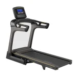 The Matrix TF30 Folding Treadmill 8.5 inch XR with its 8.5-inch XR LCD console, shown in its upright, folded position