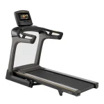 The Matrix TF50 Folding Treadmill 10 inch XER with its large 10-inch XER touchscreen console, shown in its upright, folded position