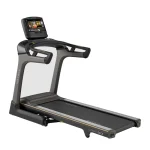 The Matrix TF50 Folding Treadmill 16 inch XIR with its large 16-inch XIR touchscreen console, shown in its upright, folded position