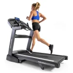 The Treadmill 7.8 AT Horizon in its folded, upright position, demonstrating its space-saving design